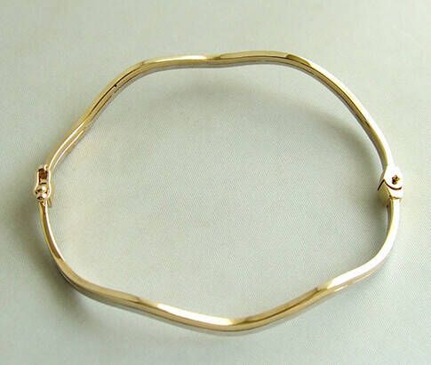 Christian Gouden bicolor slavenarmband golvend model(copy )